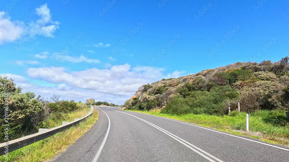 Fototapeta premium Winding Asphalt Road Along the Scenic Great Ocean Road in Australia