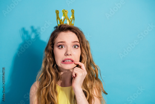Bild auf Leinwand Young woman wearing yellow dress making a funny timid expression with a playful
