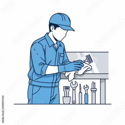 Man in blue uniform holding tools.