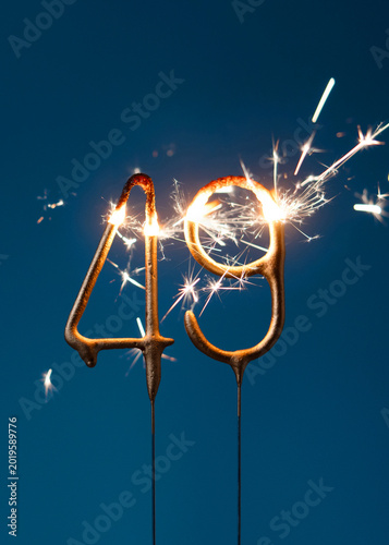 Konstfotografi 49 years celebration festive background made with Bengal fires in the form of number forty nine