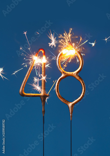 Canvastavla 48 years celebration festive background with copy space made with Bengal fire in the form of number Fourty eight