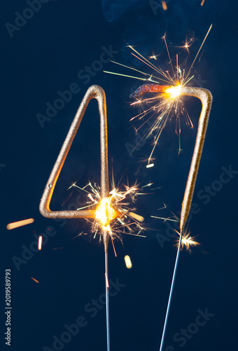 Canvastavla 47 years anniversary celebration festive background made with Bengal fires in the form of number Forty seven