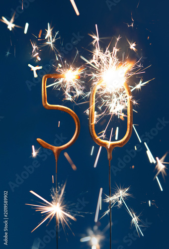 Konstfotografi 50 years anniversary celebration festive background with copy space made with Bengal fire in the form of number Fifty