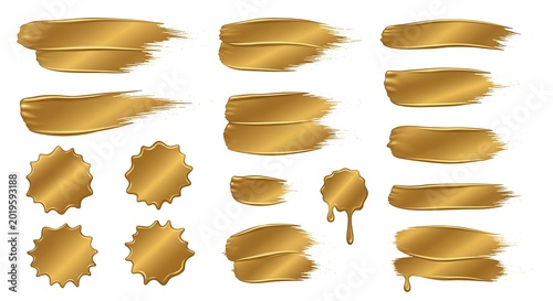 Golden paint strokes and badges on white background for design elements