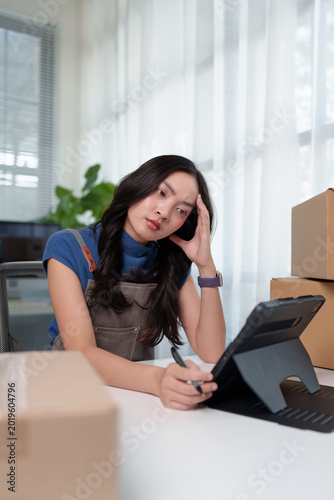 Female small business owner feeling stressed with work