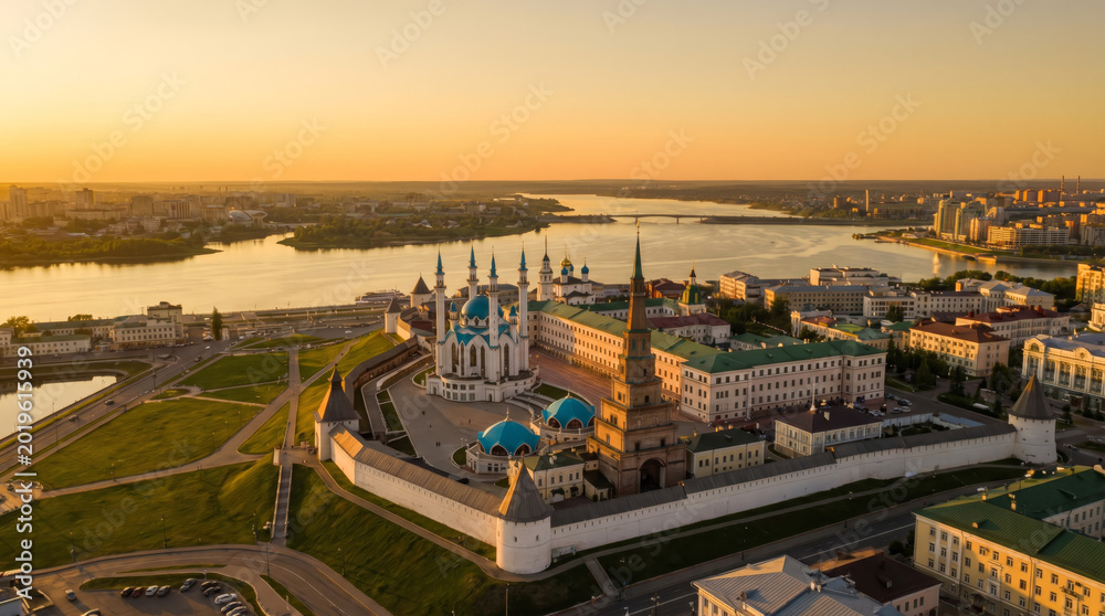 Fototapeta premium Aerial view of the Kazan Kremlin complex with Kul Sharif Mosque and Suyumbike Tower at sunset.
