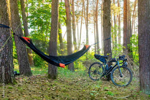 Camping with a hammock in the woods after cycling
