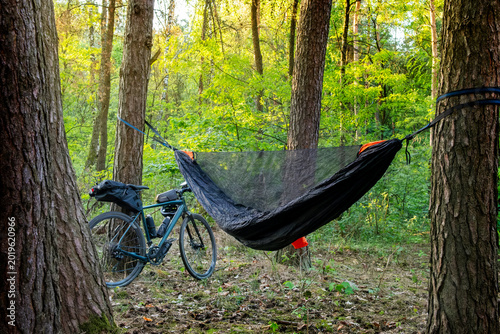 Camping with a hammock in the woods after cycling