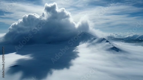 Dramatic clouds above the fog.