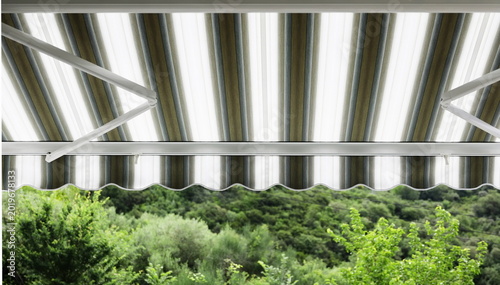 Tableau sur toile Close up outdoor automatic sliding canopy retractable roof system, patio awning