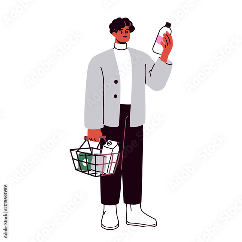 Man holding bottle and grocery store basket during food shopping. Supermarket...