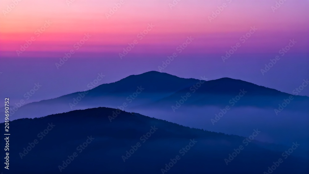 Fototapeta premium Mountain landscape at dawn with fog