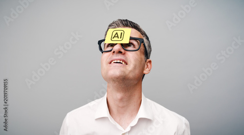 Quadro su tela An enthusiastic man with a Post-it note on his forehead that says “AI