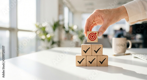 Canvastavla Goal achievement concept with hand placing target wooden block on checkmark pyra