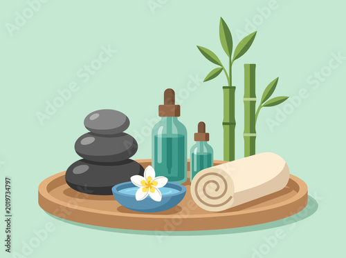 A tranquil arrangement of spa essentials including stones, bamboo, essential oils, and a rolled towel, perfect for promoting relaxation and wellness.