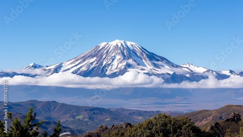 Panoramic view of the snow-covered volcano Nevado del Ruiz under clear skies 
