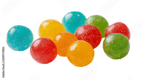 Assorted colorful round sour candies with granulated sugar coating, isolated on transparent background