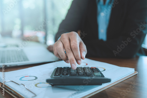 Картината върху платно Financial data analysis corporate audit concept business person using calculator