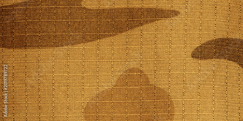 Desert camouflage fabric texture creating military background