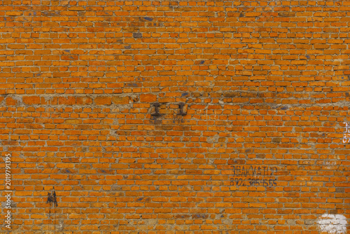 Bild auf Leinwand Highresolution image showcasing worn orange brick surface with subtle repairs an