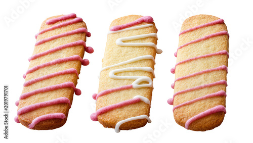 Tableau sur toile Three rectangular shortbread cookies with pink and white icing drizzle, isolated