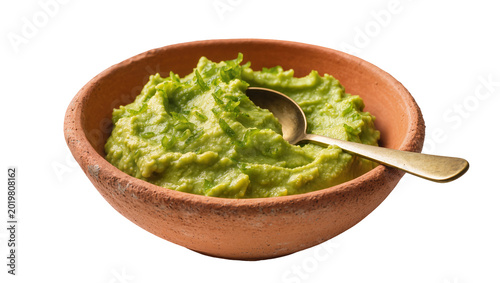 Fotografía Rustic terracotta bowl filled with chunky green guacamole golden spoon resting i