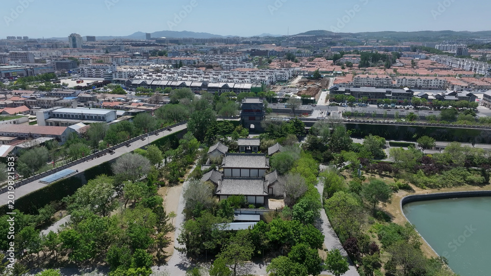 Fototapeta premium Aerial view of Qingzhou Ancient City featuring traditional architecture, gardens, and water systems