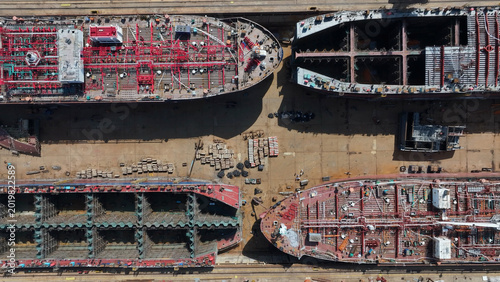 Konstfotografi Aerial view of four ships under construction in a dry dock shipyard