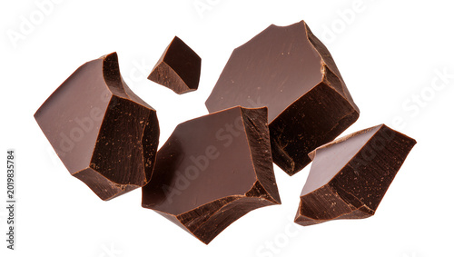 Quadro su tela Dark chocolate chunks scattered, isolated on transparent background