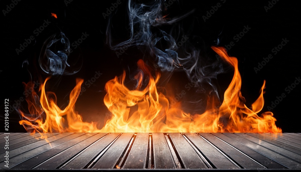 Fototapeta premium empty hot barbecue grill with bright flames and smoke on black background