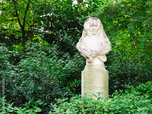 Bust of Sophie Rostopchine in the Jardin du Luxembourg in Paris surrounded by greenery on a sunny day
