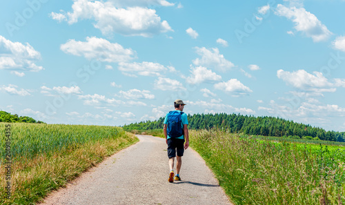 Travel destination Palatinate Forest, Germany. Landscape Scenery with backpacker and base cap