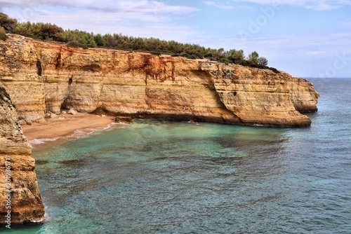 Benagil Beach (Praia de Benagil) and cliffs in Algarve region, Portugal. Popular tourism destination in Portugal.