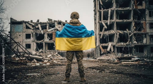 Ukrainian Soldier Holds Flag Amidst Destroyed Building Symbolizing Resilience.