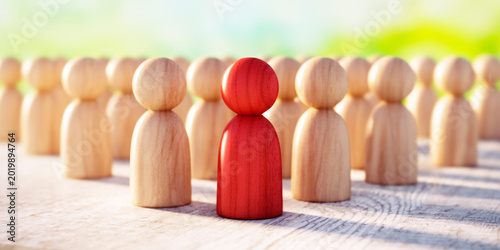 A Group of Wooden Figurines Arranged on a wooden Surface with One red in Focus and Others Blurred - Concept of Unity and Individuality - 3D illustration