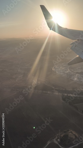 Tel-Aviv Israel - October 27 2024 Airplane wing Sunrises Airport exterior view wing Airplane runway transport transfer transportation outside editorial photography . High quality photo
