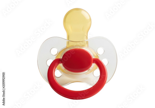 A red and white pacifier with a yellow handle resting on a white background