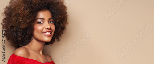 Beauty portrait of African American girl with afro hair. Beautiful black woman. Cosmetics, makeup and fashion