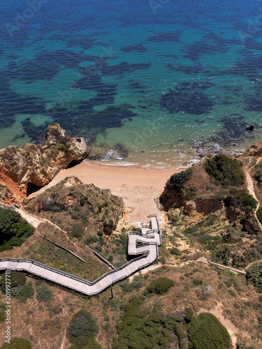 Aerial drone view of Praia Dona Ana beach and cliffs in Lagos Algarve Portugal