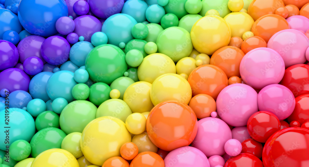 Obraz premium A captivating visual symphony of glossy, multicolored 3D spheres, meticulously arranged in a dynamic, gradient flow, creating a vibrant abstract background texture