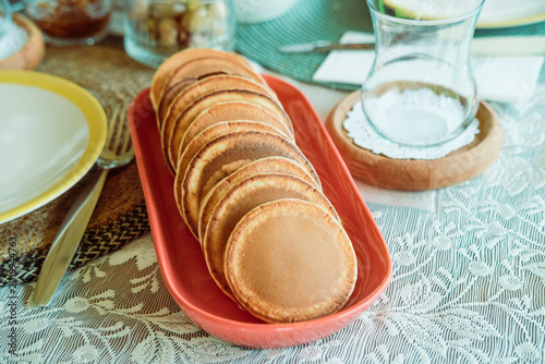 pancakes spong soft served with turkish tea glass for breakfast or branch, summer outdoors lifestyle
