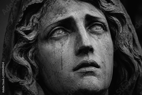 Dramatic stone face symbolizing tragedy prophecy and disbelief