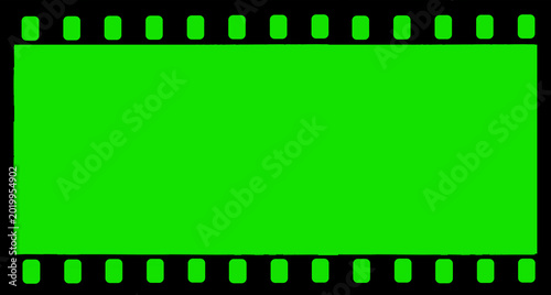 Φωτογραφία Black vintage film strip with green background, perforations and subtle scratche