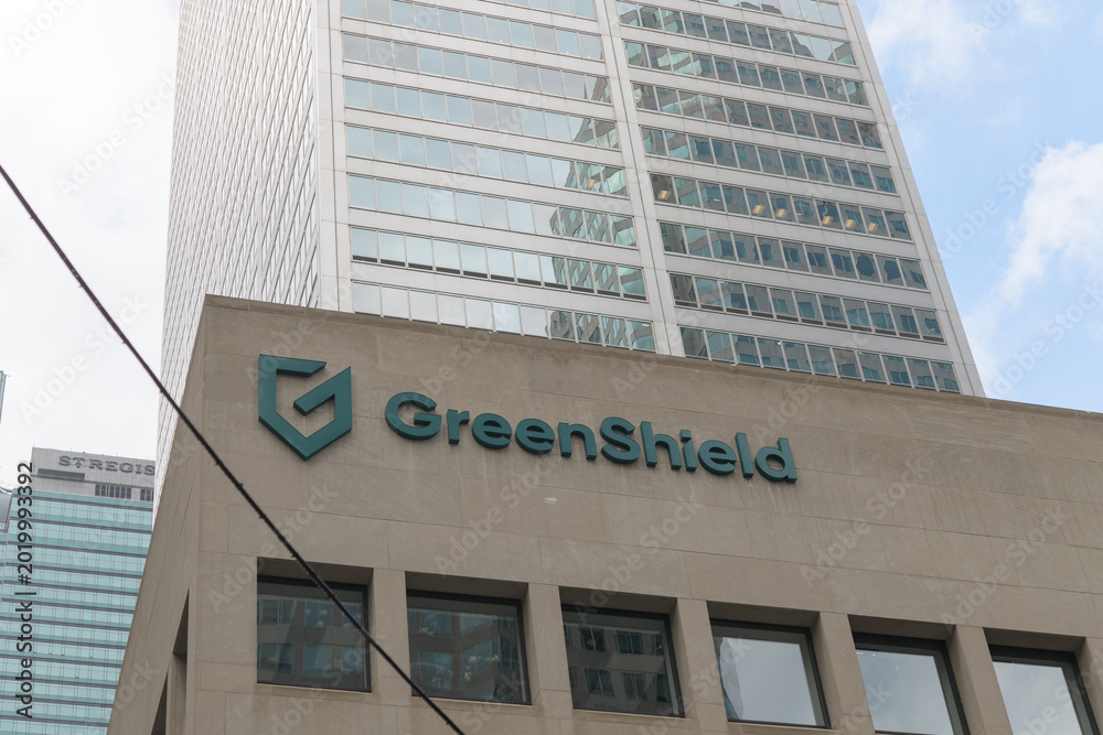 Fototapeta premium exterior building facade and sign of GreenShield, a major Canadian health and benefits organization, located at Commerce Court South, 30 Wellington St W, Toronto