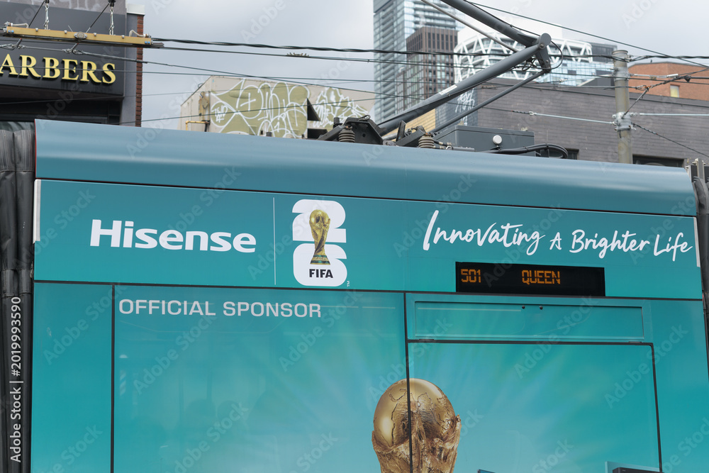 Fototapeta premium streetcar wrap with Hisense sponsor advertising for FIFA World Cup 2026, Toronto