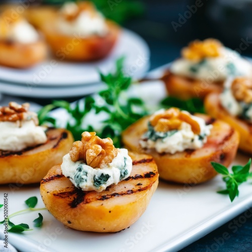 Grilled Peaches Topped With Cheese and Walnuts on a White Plate at a Summer G...