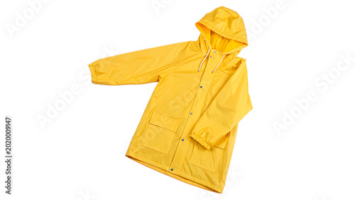 Photos A bright yellow waterproof raincoat jacket with long sleeves and hood isolated o