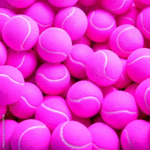 Bright Pink Tennis Balls Fill the Surface, Creating a Vivid Scene for a Sport...