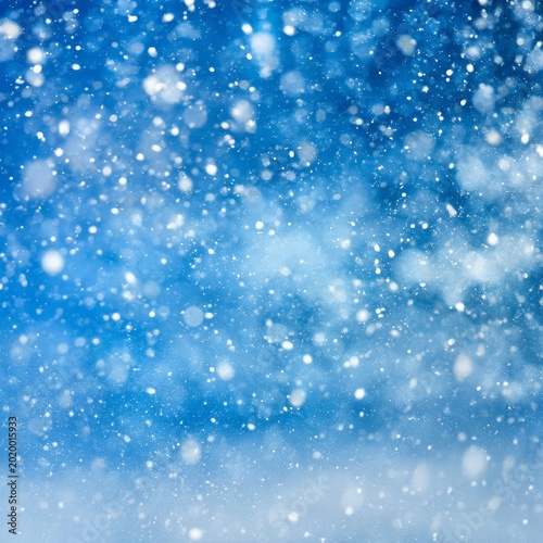 Snowflakes Fall Gently Against a Bright Blue Sky on a Cold Winter Day