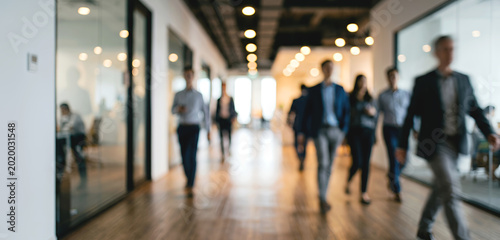 Bilde på lerret A busy office corridor filled with professionals walking and engaging in their work environment, showcasing modern architecture and bright lighting